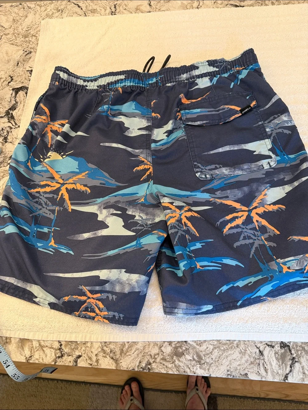 O’Neill bathing suit with two pockets one back pocket with Velcro